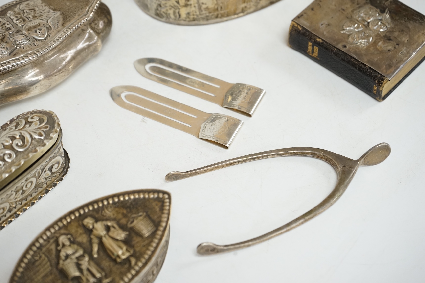 Three late 19th/early 20th century repousse silver trinket boxes, including one with Reynold's Angels decoration, Birmingham, 1899, 91mm, a larger 19th century Dutch white metal oval box and cover, a pair of wishbone sil